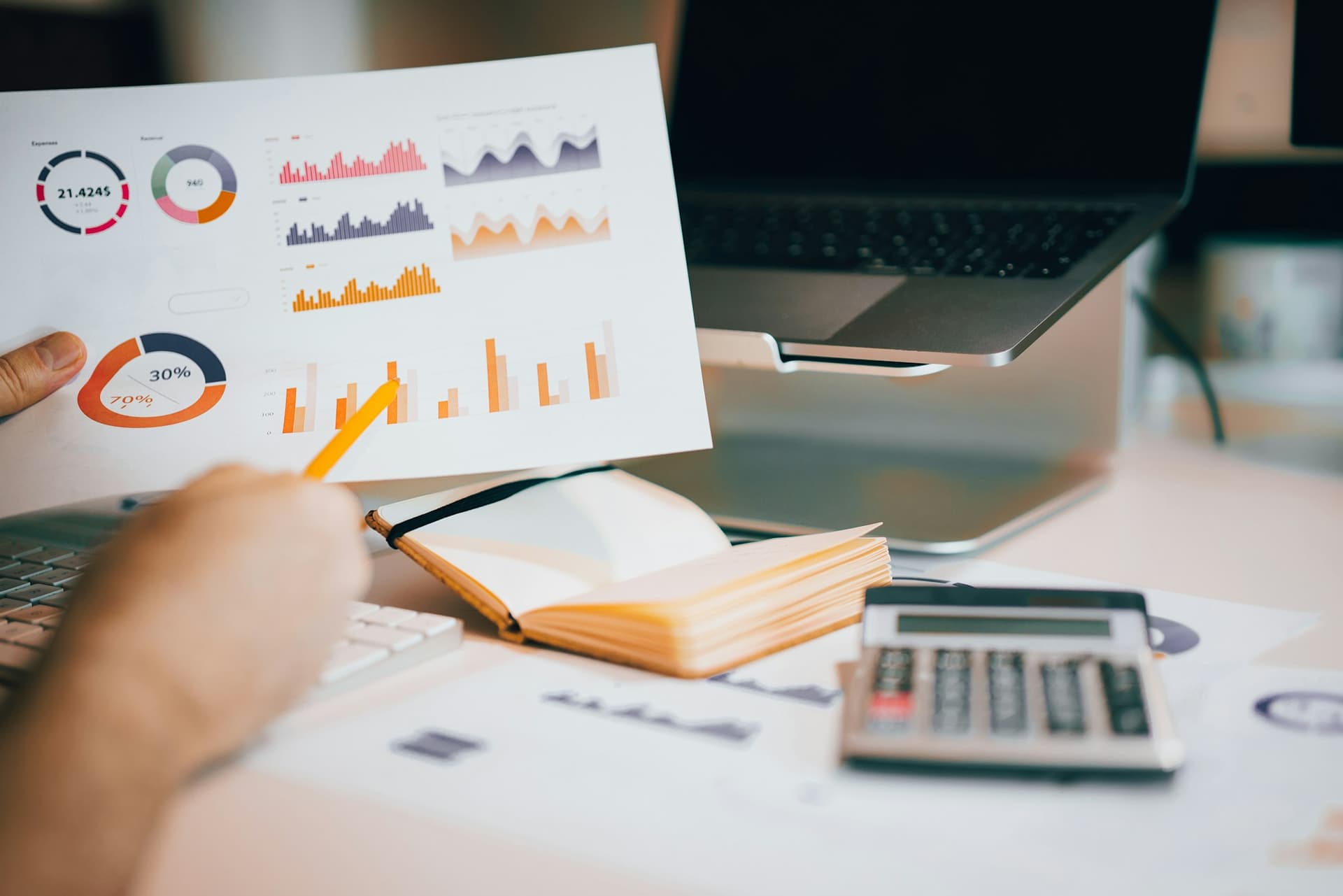 A financial report being walked through line by line with a pencil