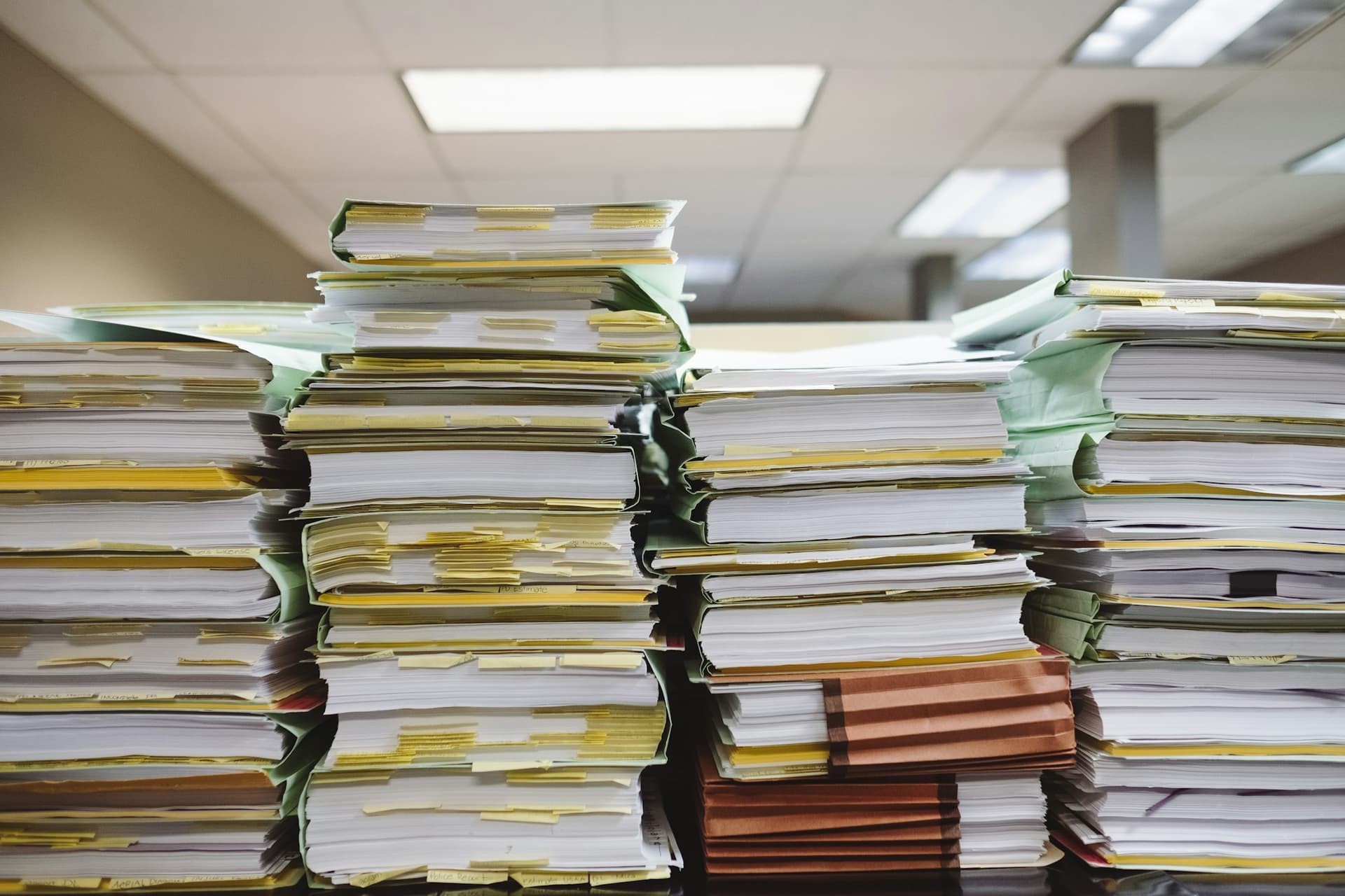 Stacks of paper files waiting to be cleaned up