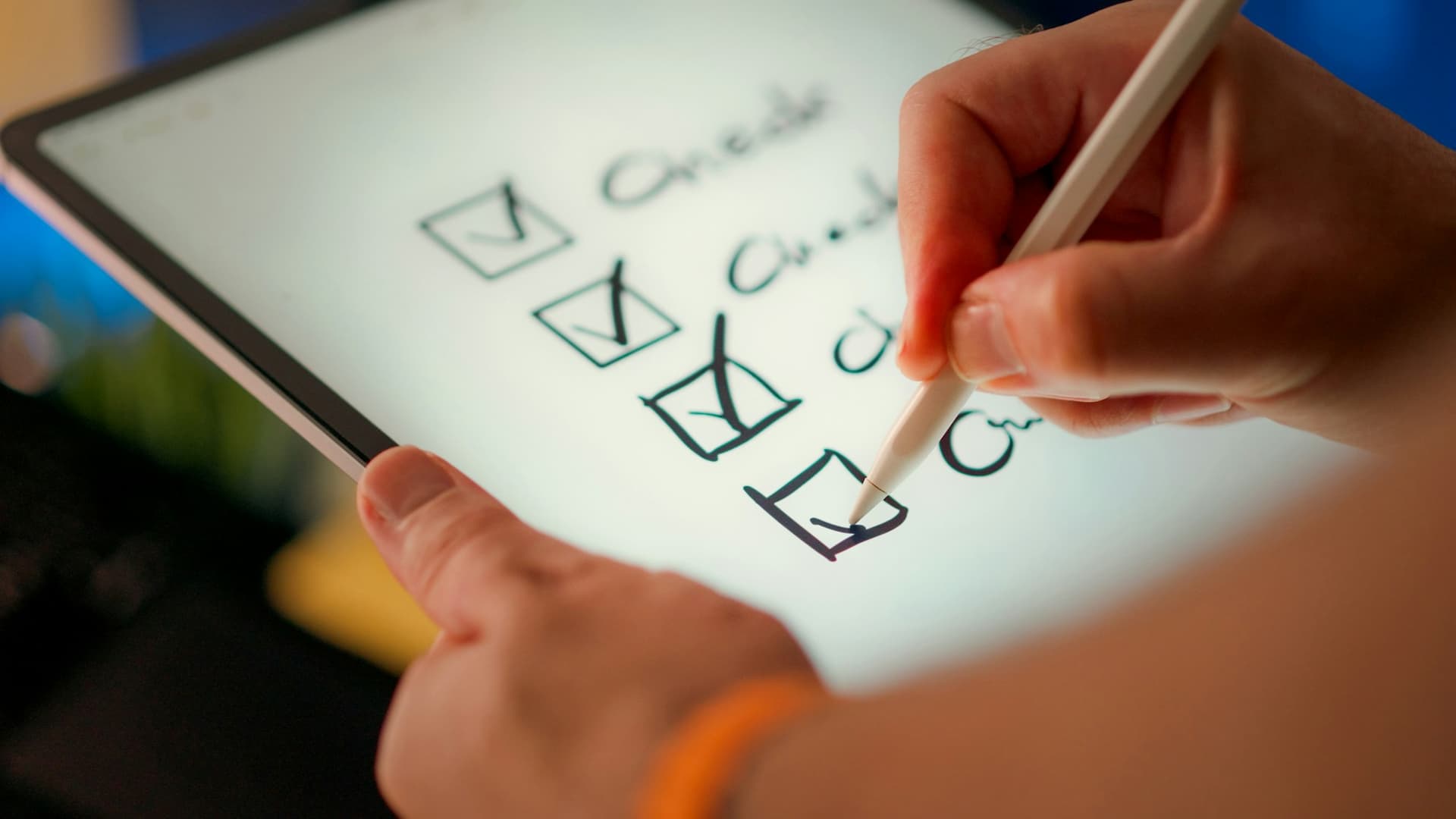 A month-end close checklist being ticked off on a tablet