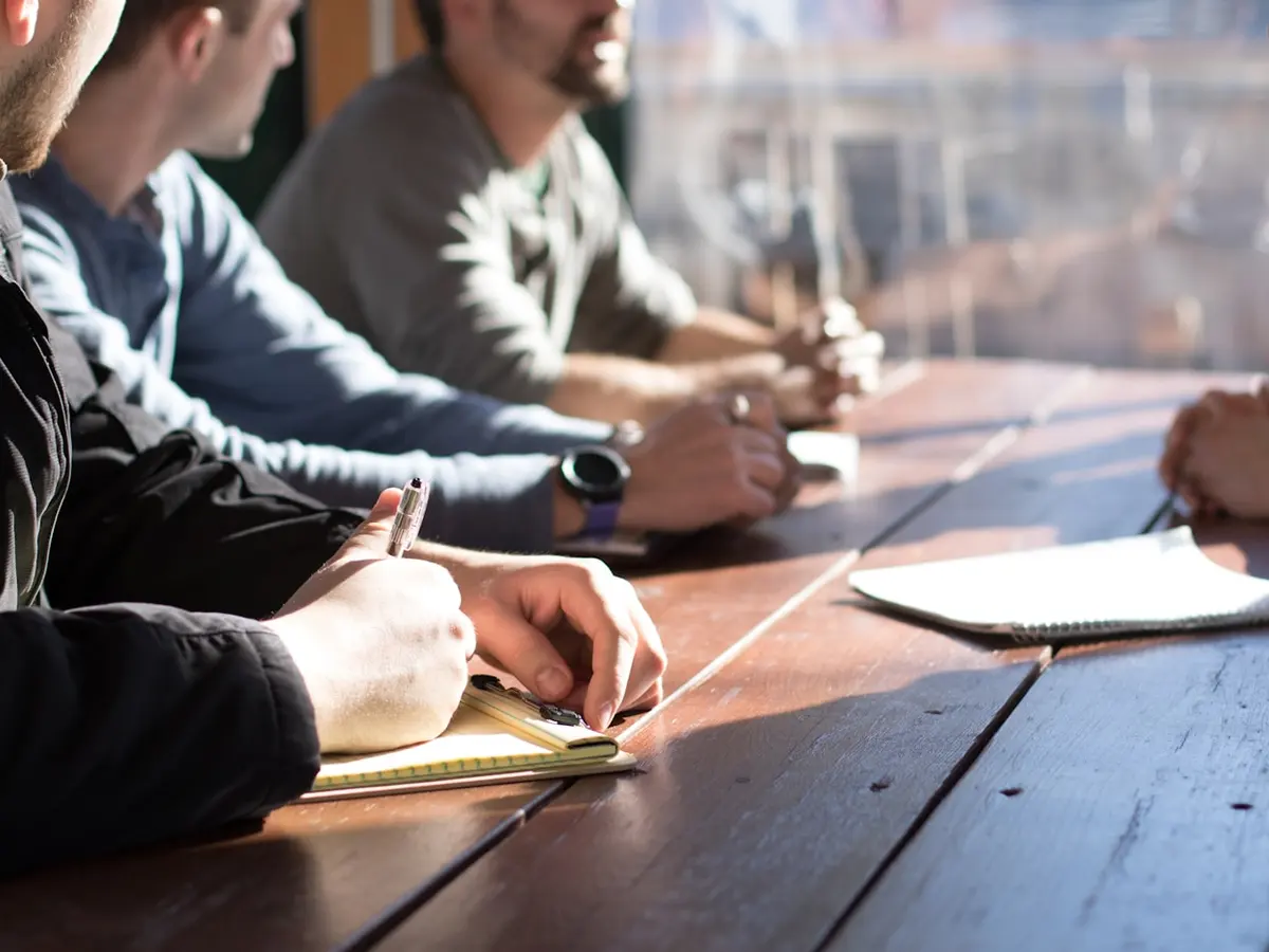 Consultants in a working session around a table