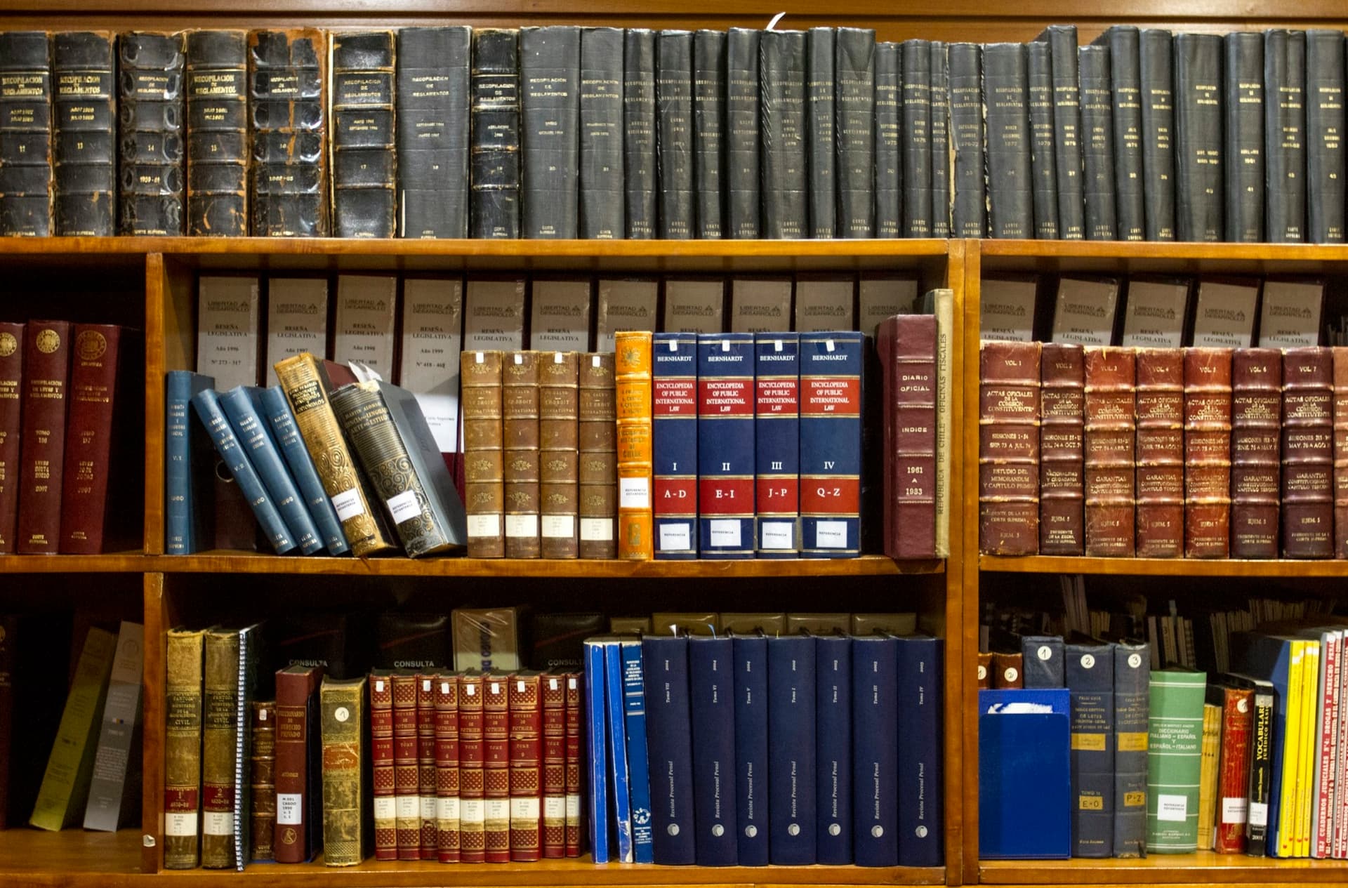 Shelves of bound reference books in a professional office