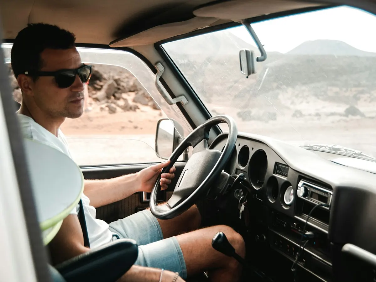 Truck driver at the wheel of his cab